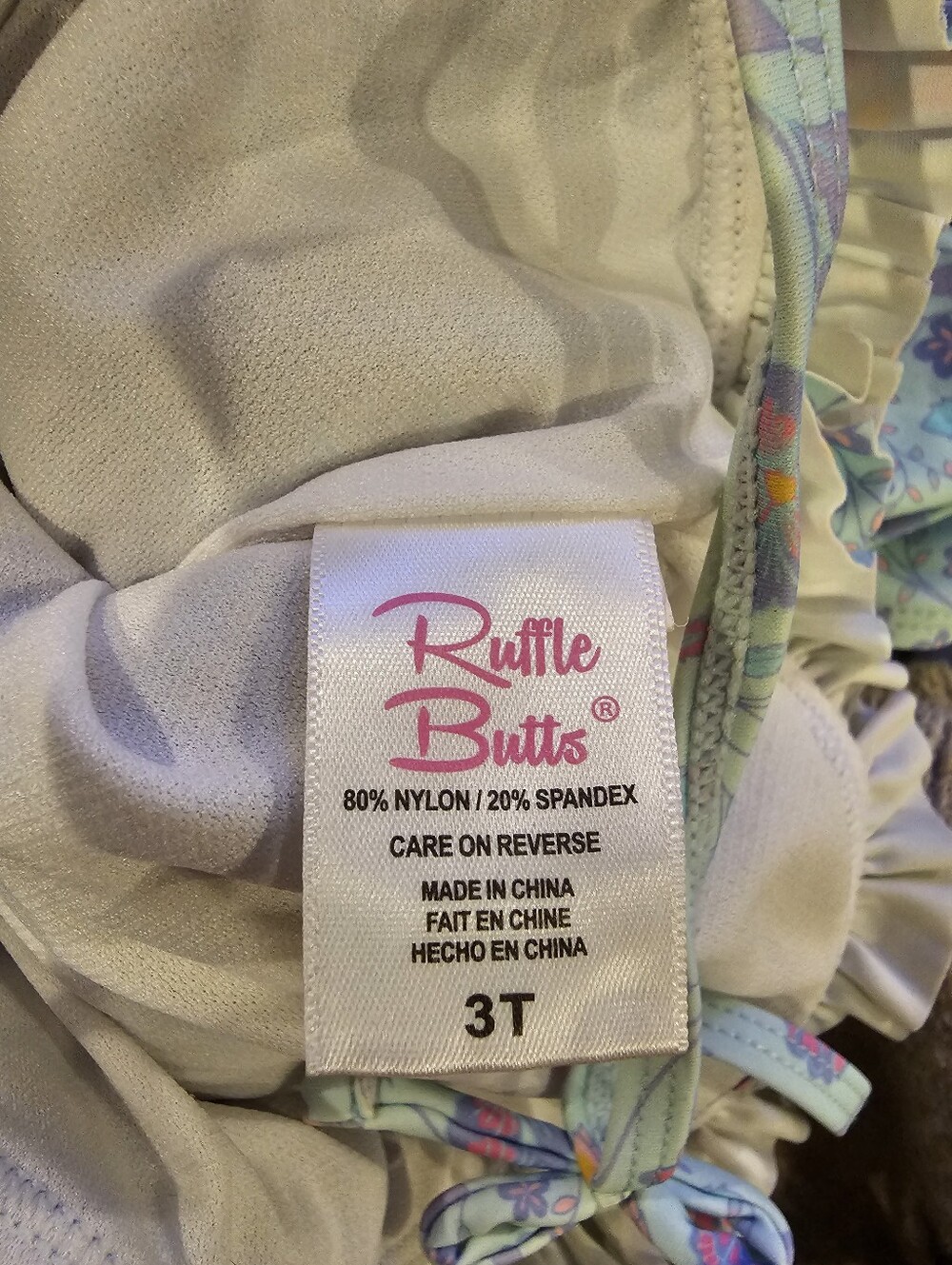 Rufflebutt Toddler Girls' Floral Light Blue Ruffled One-Piece Swimsuit. Like New - Picture 4 of 4